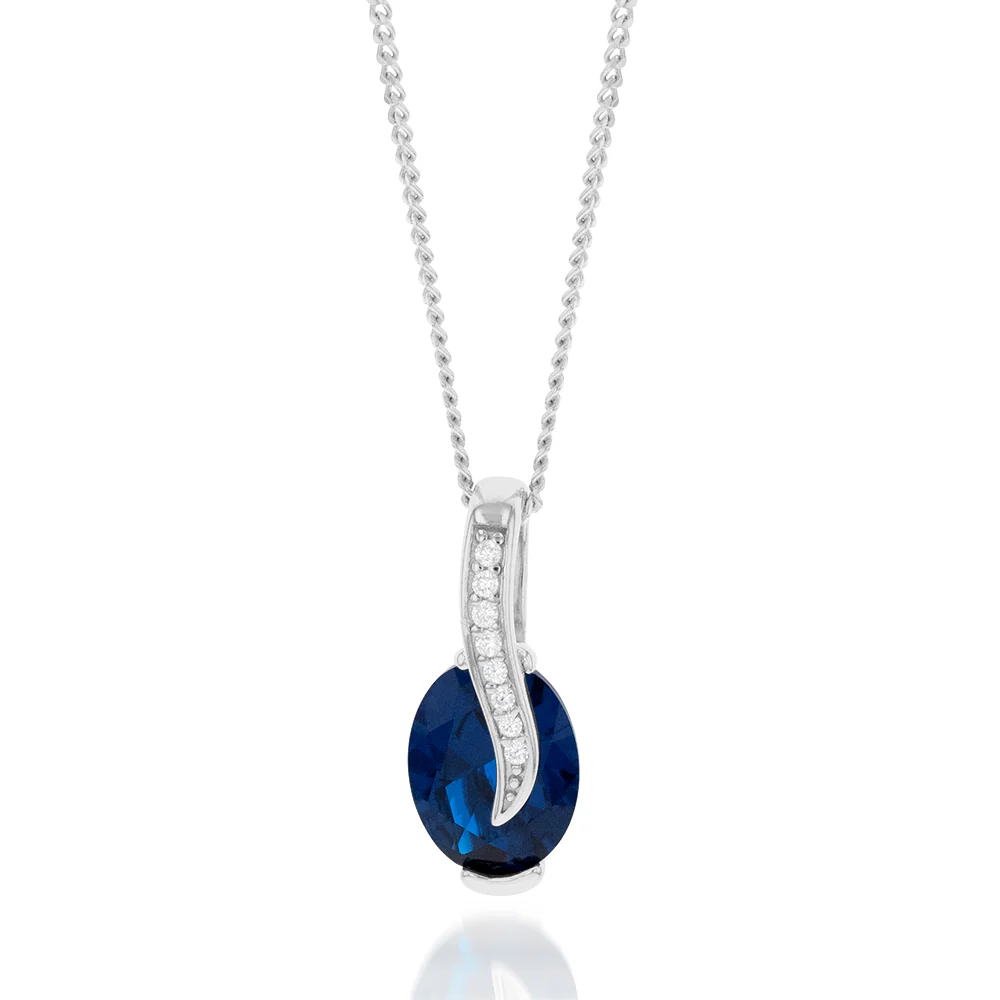 Sterling Silver Rhodium Plated Oval Synthetic Spinel Cubic Zirconia Crossover Pendant